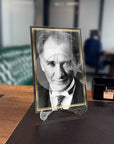 Atatürk 165 Cam Tablo on a desk, framed portrait with Turkish flag design.