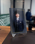 Atatürk glass art piece on a desk, showcasing high-quality UV printing in an elegant office setting.