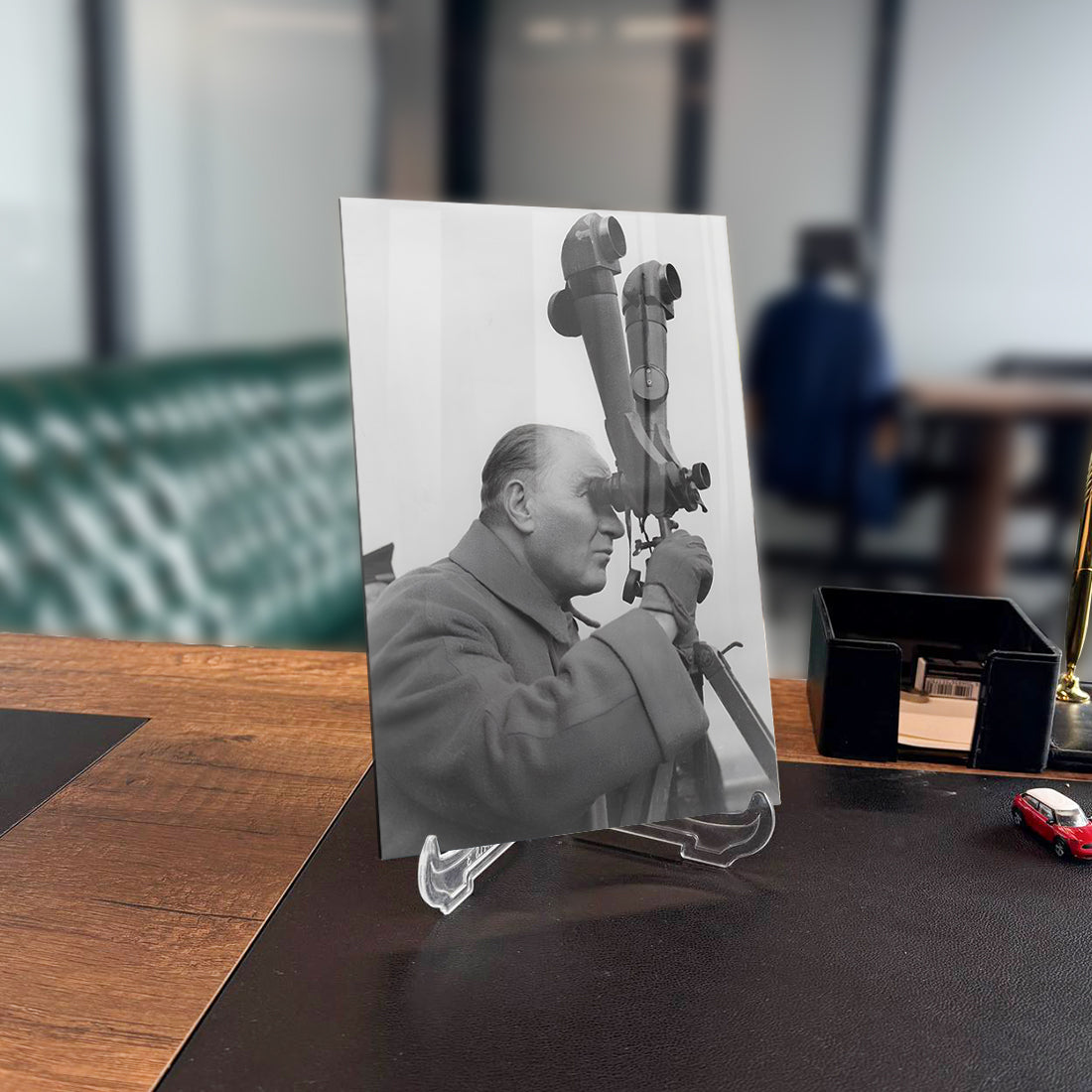 Black and white glass artwork of a man observing through a telescope, showcasing artistic design and high-quality craftsmanship.