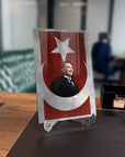 Atatürk 223 glass plaque with Turkish flag design on a desk, showcasing high-quality tempered glass.