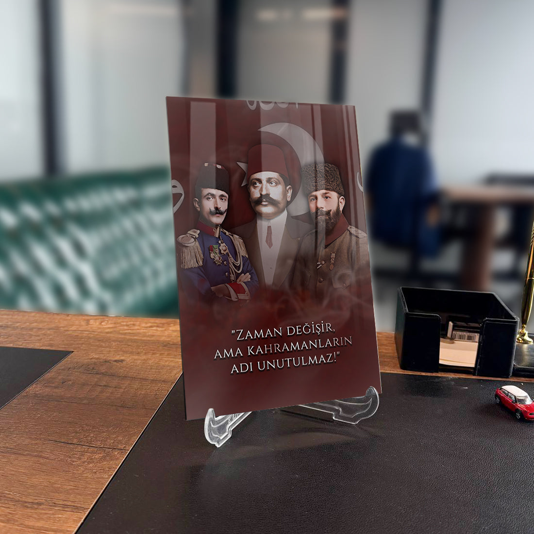 Enver Talat Cemal Paşalar Cam Tablo with inspirational quote displayed elegantly in a modern office setting.