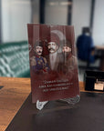Enver Talat Cemal Paşalar Cam Tablo with inspirational quote displayed elegantly in a modern office setting.