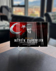 Atatürk themed tempered glass art piece featuring Turkish flag with quote 'Rüyik Zaferler' on a display stand.