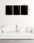 Three black glass wall art pieces above a white sofa, showcasing modern decor for stylish interiors.