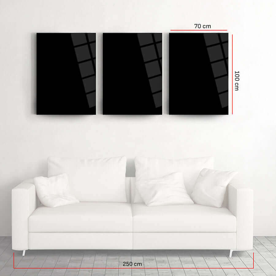 Stylish SRD Concept 3-piece glass wall art above a modern white couch, ideal for contemporary home decor.