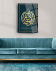 Elegant Cam Tablo featuring Arabic calligraphy on a stylish wall above a modern blue sofa.