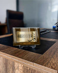 Asr Suresi glass art piece displayed on a wooden desk, showcasing elegant design and Quranic calligraphy details.
