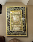 Hilye-i Şerif glass artwork with intricate gold and black designs, showcasing Islamic calligraphy on the wall.
