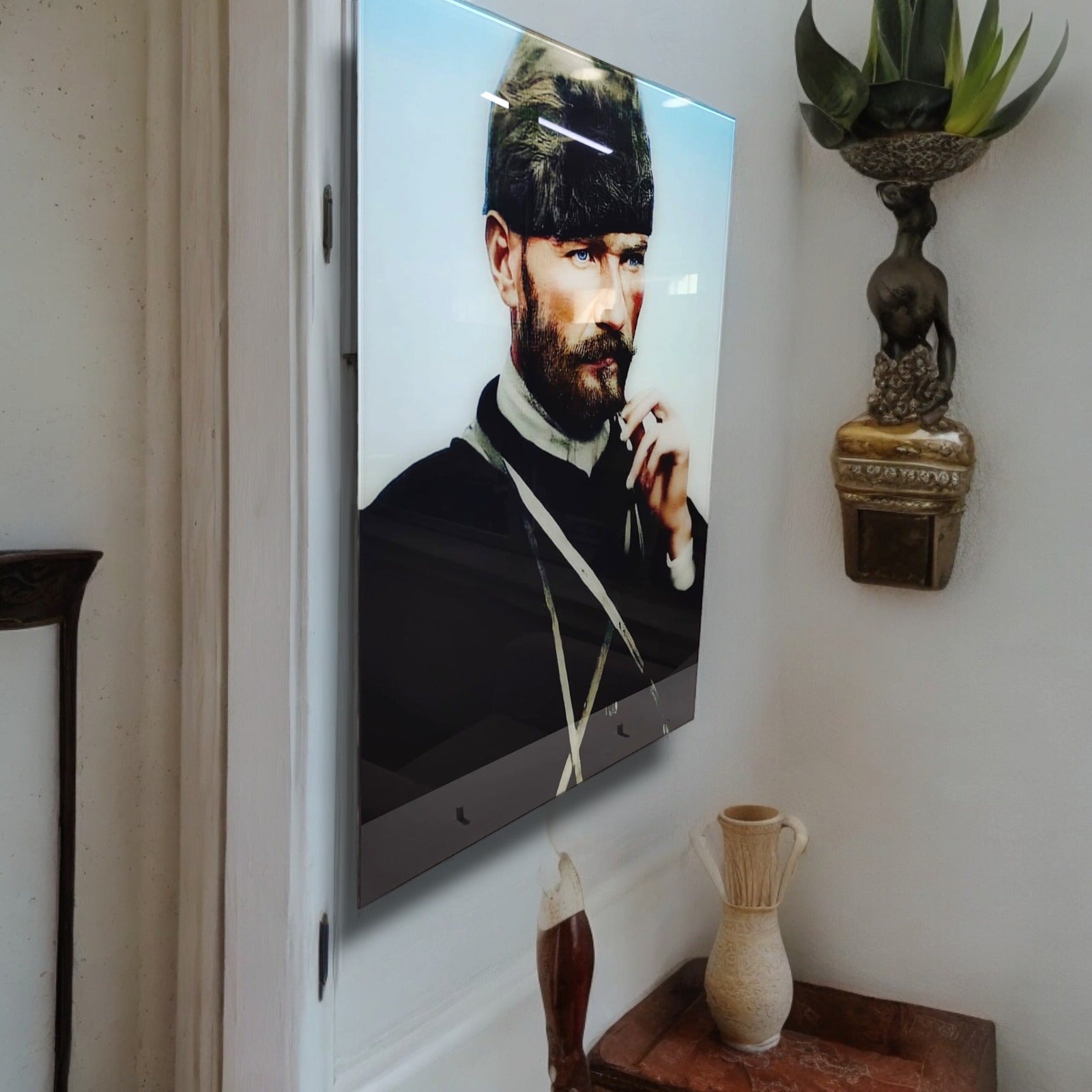 Atatürk 56 Cam Tablo displayed on a wall, showcasing high-quality UV printed design on tempered glass.