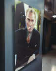 Stylish indoor display of a high-quality glass artwork featuring a well-dressed man in a suit and tie.