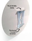 Easy wall mounting with a single nail for round glass art, showing metal hanger on the back.