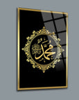 Elegant glass art featuring the name 'Muhammed' in gold on a black background, framed beautifully for modern decor.