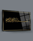 Bismillahirrahmanirrahim art piece on black glass, elegant gold lettering, high-quality tempered design.