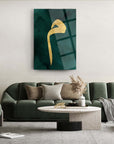 Elegant home decor featuring a green wall art piece with a gold design, complementing a stylish living room setup.