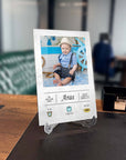 Personalized photo frame display featuring a smiling baby boy named Aras in a stylish setting.