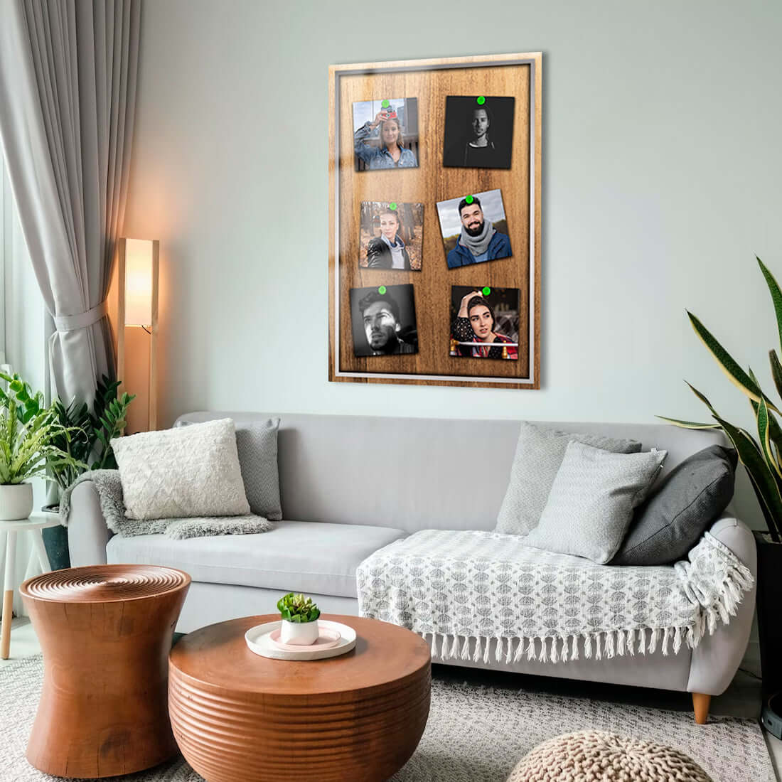 Modern living room featuring a stylish photo collage frame on a wall, surrounded by cozy furniture and plants.