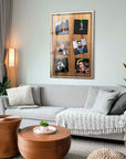 Modern living room featuring a stylish photo collage frame on a wall, surrounded by cozy furniture and plants.