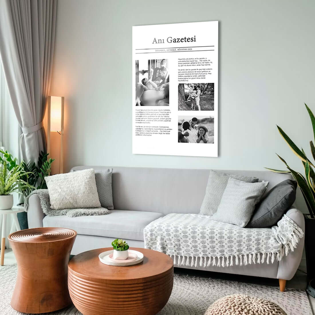 Modern living room featuring a stylish wall art piece titled "Anı Gazetesi" above a cozy sofa.