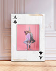 A stylish framed photo depicting two playful girls posing in front of a pink background with an Ace of Spades design.