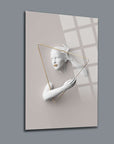 Modern wall art featuring a mannequin with geometric design elements in neutral tones.