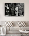 Black and white photo of a historical group portrait displayed above a modern couch in a cozy living room.