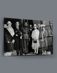 Historical black and white image of a group of elegantly dressed individuals in formal attire.