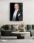 Elegant man in tuxedo portrait displayed above modern green sofa in chic living room setting.