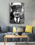 Black and white portrait of a man wearing a traditional hat, displayed above a modern couch in a stylish living room.