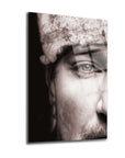 Close-up of a male face with deep eyes on a high-quality glass panel artwork.