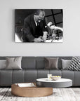 Black and white Atatürk 161 Cam Tablo on modern living room wall, featuring elegant decor and furniture.