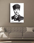 Stylish black and white Cam Tablo of Atatürk displayed on a living room wall above a grey couch.