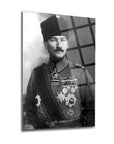 Black and white portrait of a man in military uniform with medals, featured on a glass surface.