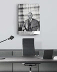 Elegant office setup featuring a framed black and white artwork of a distinguished man.