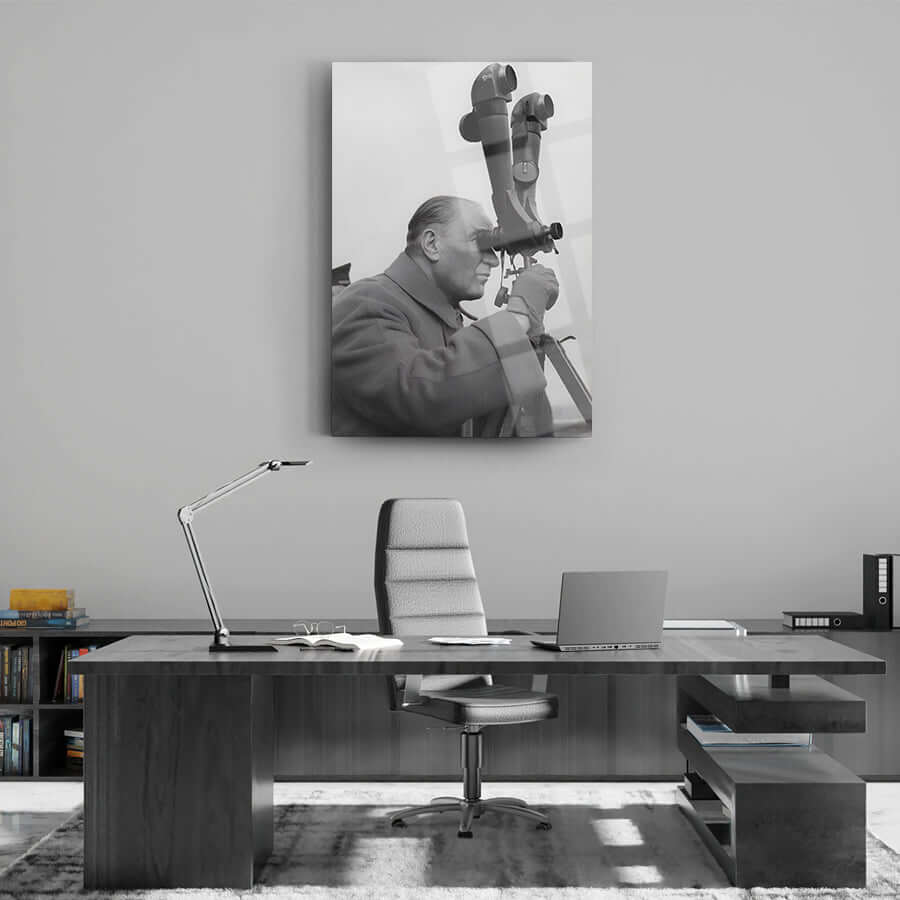 Black and white cam tableau featuring a man observing through a telescope, set in a modern office environment.