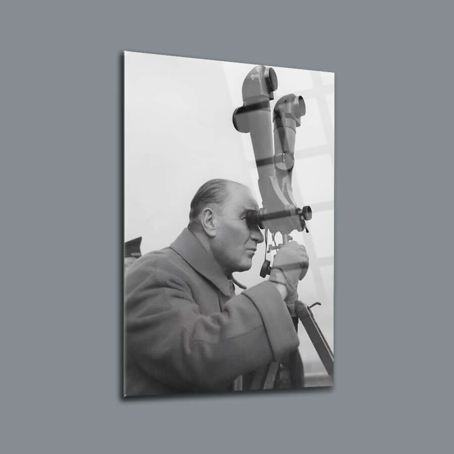 Black and white cam tablo depicting a man looking through a telescope, highlighting craftsmanship and design.