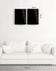 Modern black glass wall art above a white sofa in a stylish living room.