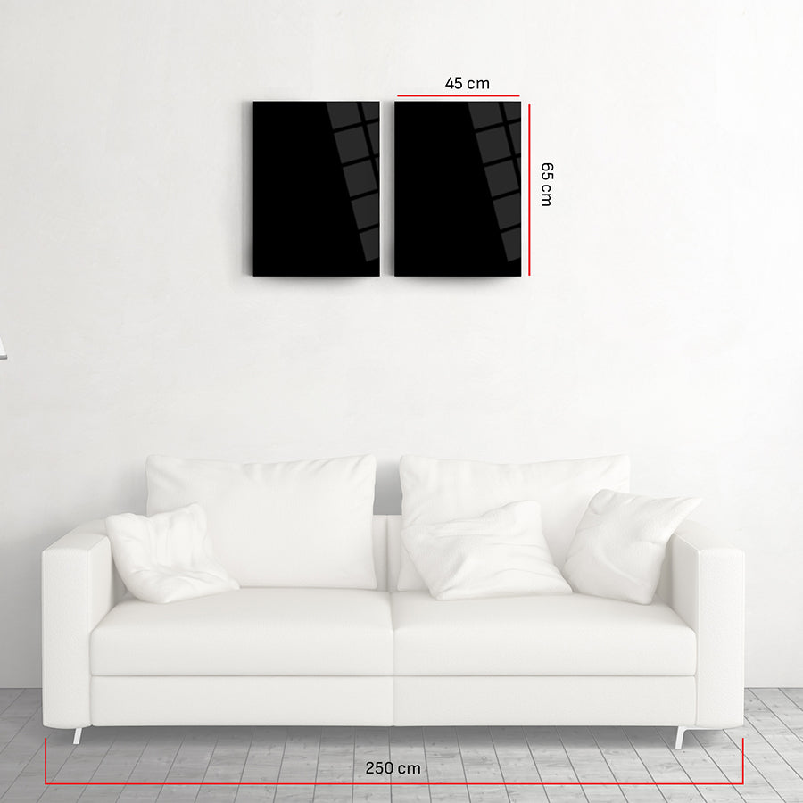 SRD Concept 2-piece black glass wall art above a modern white sofa in a bright room, showcasing unique design and dimensions.