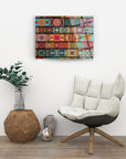 Vibrant colored motifs glass wall art in modern living room with chair and wooden decor.