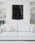 Modern Pi art on a sleek black canvas above a stylish white sofa in a cozy living room.