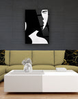 Modern living room with a black and white abstract art piece above a stylish sofa and table.