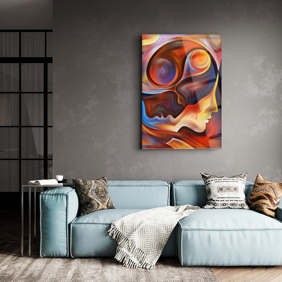 Modern art piece featuring colorful abstract faces, perfect for enhancing living room decor.