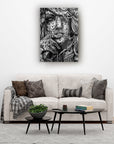 Artistic black and white wall art above a modern sofa in a stylish living room decor.