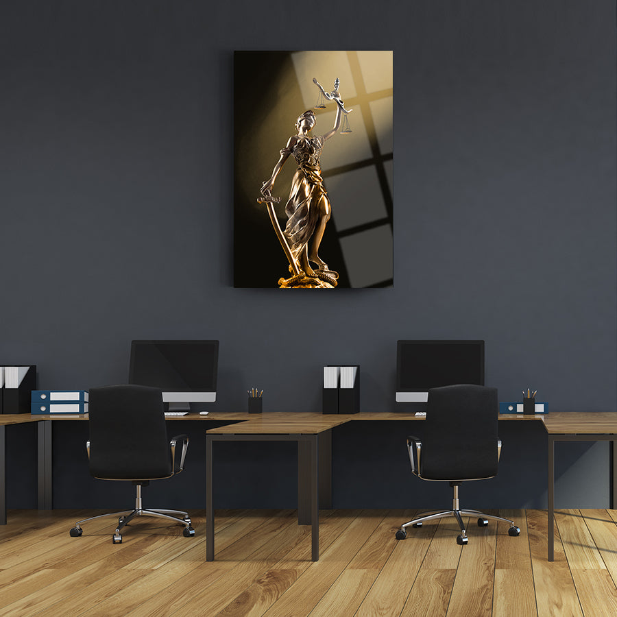 Themis statue glass art piece displayed in a modern office workspace, showcasing elegance and strength.
