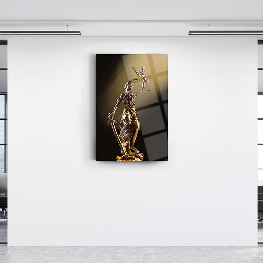 Themis statue in gold, elegantly displayed on a wall, symbolizing justice and integrity.