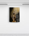 Themis statue in gold, elegantly displayed on a wall, symbolizing justice and integrity.