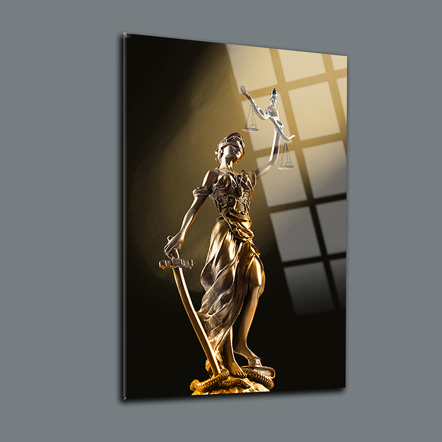 Themis statue on a stylish cam tableau, showcasing justice with sword and scales, an elegant decor piece.