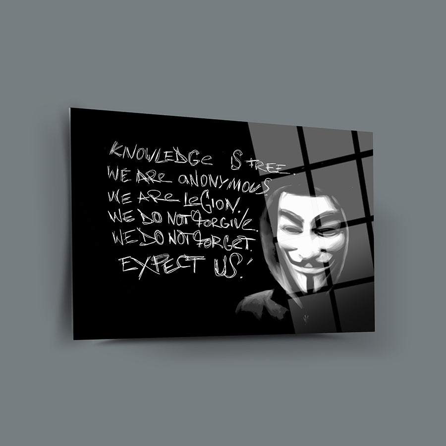 Artistic glass panel featuring a Guy Fawkes mask with the quote 'Knowledge is Free, We Are Anonymous'.