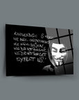 Artistic glass panel featuring a Guy Fawkes mask with the quote 'Knowledge is Free, We Are Anonymous'.