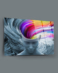 Modern glass wall art featuring abstract colorful thoughts emanating from a serene human figure.