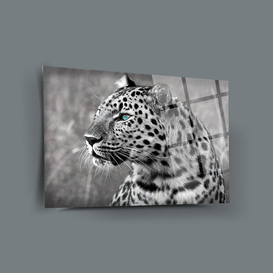 Artistic black and white image of a leopard with striking blue eyes, beautifully highlighted.